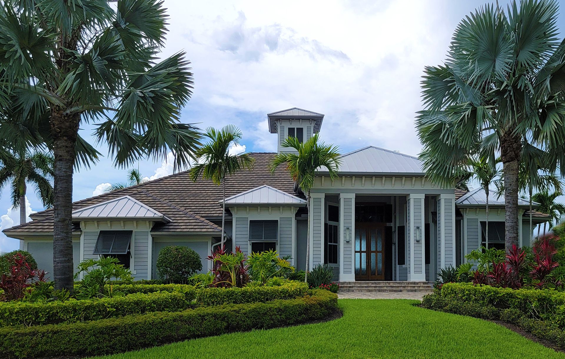 Sunny Florida home with palm trees in Vero Beach