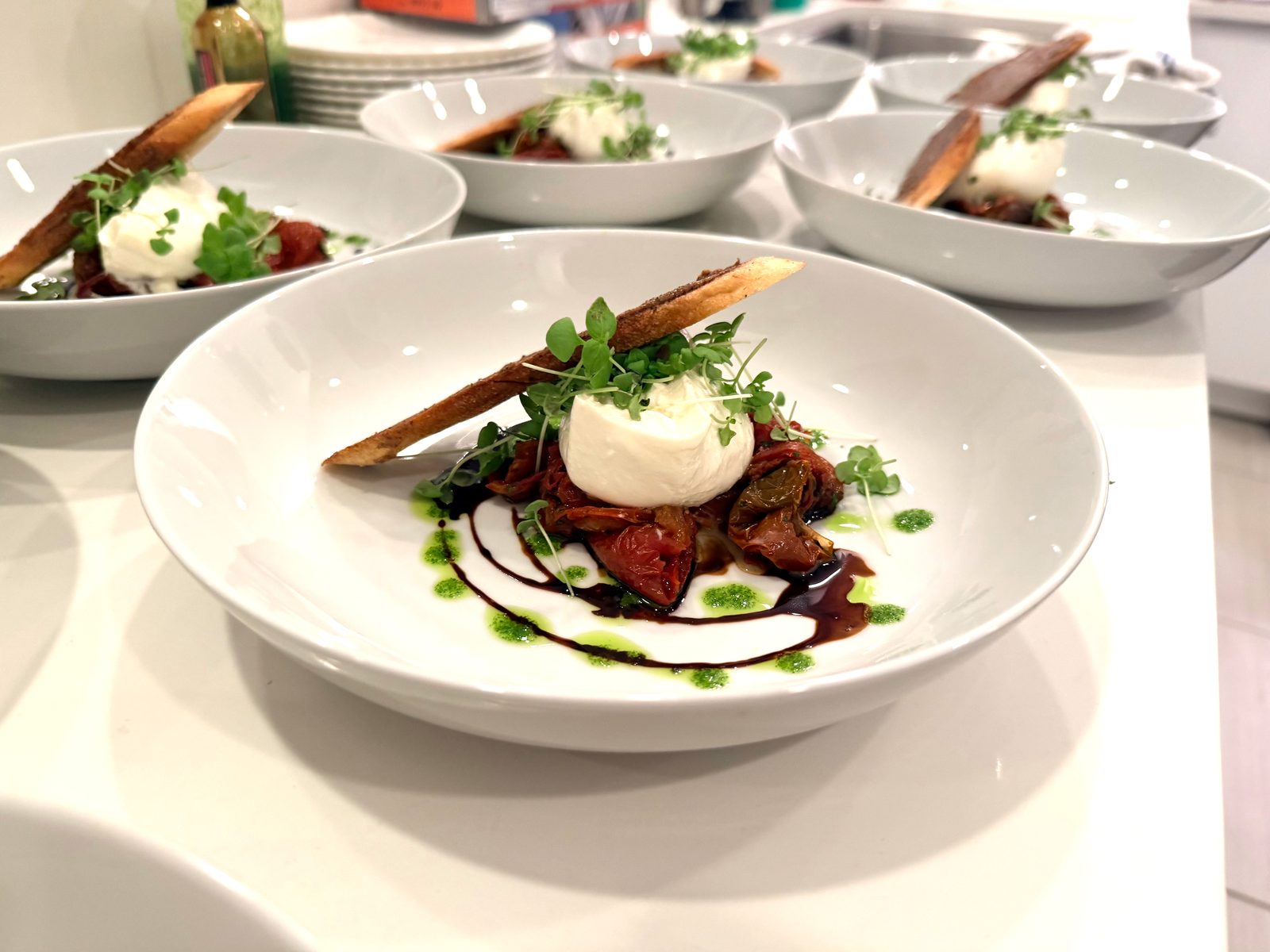 Plated dish by Vero Beach Private Chef — burrata with roasted tomatoes
